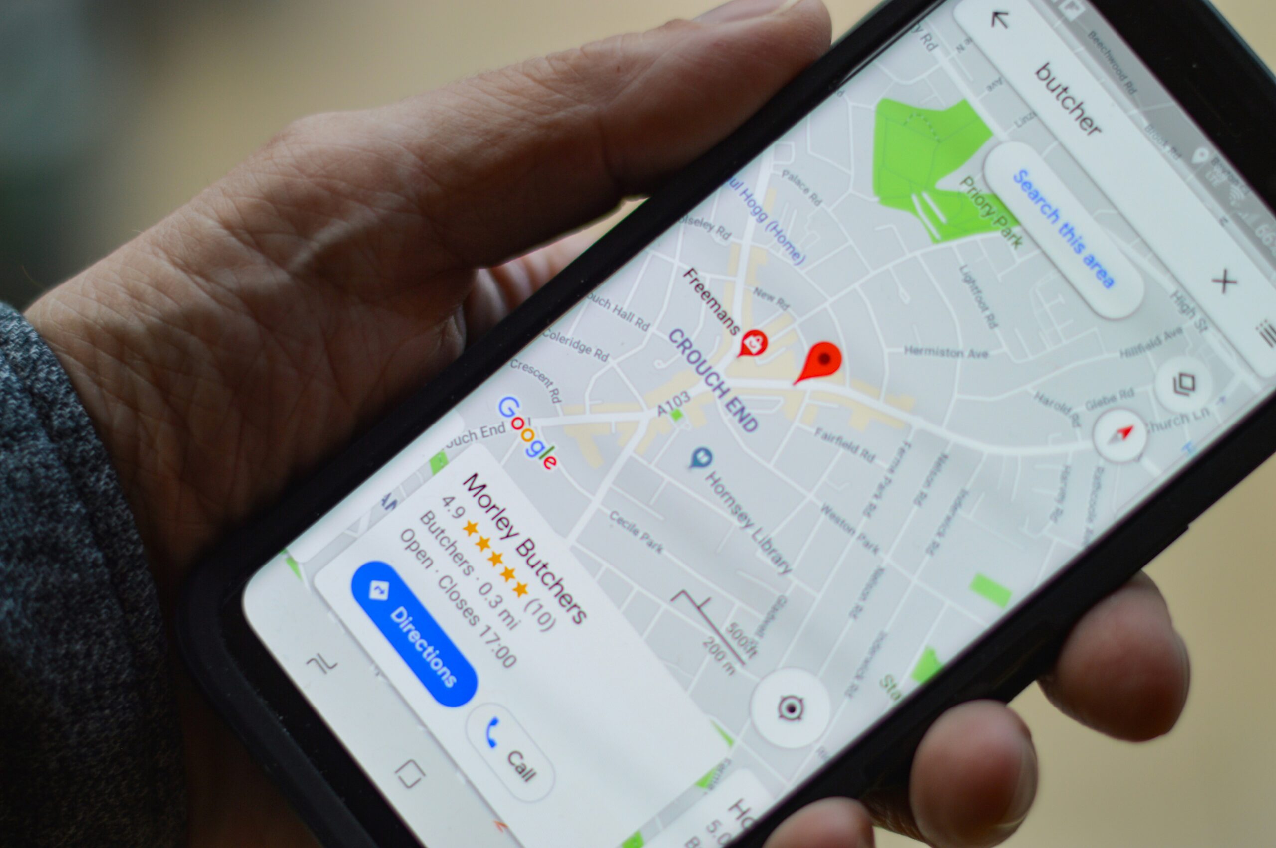 Smartphone showing Google Maps navigation for local business search
